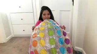 Blowing up this big beach ball by mouth