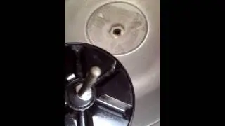 Replacing the activator in a washing machine.