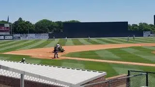 Quincy Hicks 17 warming up throw from warning track.