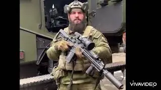 Hussein Mezhidov carrying a captured Ukrainian UKROP UAR-15 rifle with thermal scope.