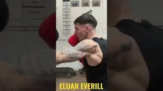 Elijah Everill working the pads wearing messenger gloves
