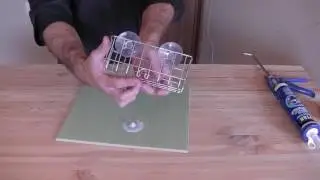 How to hang a shelf in the bathroom with suction cups