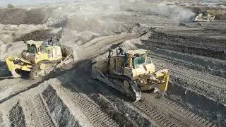 Aerial View Of Four Caterpillar D9T & Komatsu D275AX Bulldozers Team -Levelling Huge Mining Site