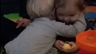Sweet Baby Boy Gives Hug and Kiss to Baby Girl