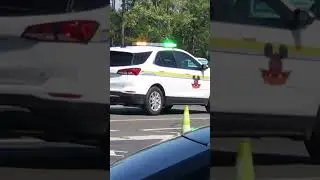 Disney Security vehicle responding with green and amber emergency lights
