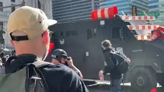 Watch protesters try to stop a swat vehicle