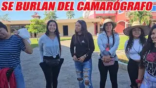 These girls cruelly mock the cameraman for his strange way of dressing.