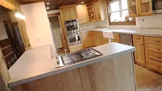 DIY Contrete Countertops with Farmhouse Sink and Drop in Stovetop.