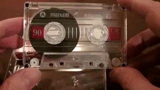 Unwrapping a Maxell UR90 audio cassette
