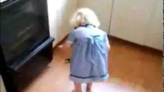 Little Girl Throw Ball to Cat
