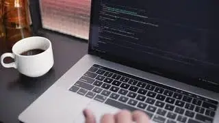 Software developer working while drinks coffee | Free stock Mac video