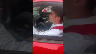 Charles Leclerc stops for fan in his Ferrari 488 pista