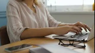 woman working with laptop computer at agency QBMR4NA