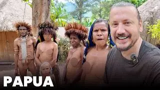 A tribe in Papua that walks naked and men who wear a stick on their genitals.