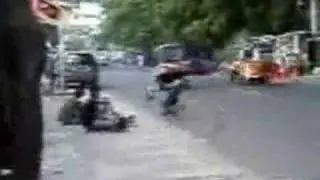 Monkey Riding little motorbike on the streets in India!
