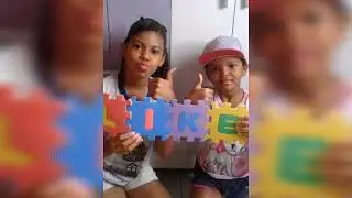 Kemilly e Bruna brincando com quebra-cabeça gigante