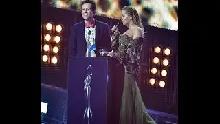 X Factor rejects Rita Ora and Nick Grimshaw reunite to present an award at the BRITs