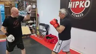 70 - year-old man punching in a Hipko  boxing gym.