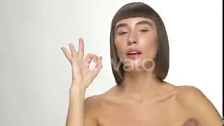 Beautiful Young Girl Pointing on Face and Showing Good Gesture | Stock Footage - Envato elements
