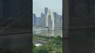 Flying Car Fly Across the Canton Tower