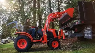 Yard waste pile pick-up | Kubota B2301