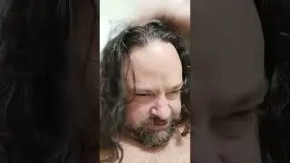 Shane's hair gets fluffy again as it dries after the pool water.