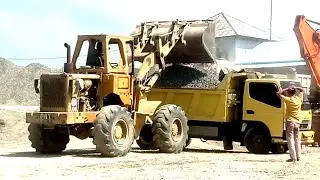 Heavy equipment using loaders to load trucks |  sand truck construction vehicle