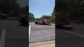Race car leaving car meet 
