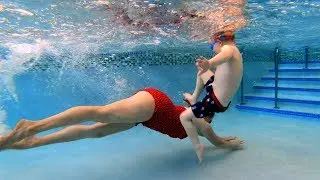 Kids Playing in the Swimming Pool with Mom