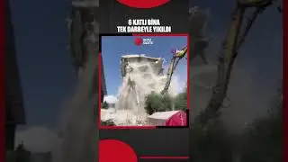 Hatay'ın Hassa ilçesinde 6 katlı binanın iş makinesinin darbesiyle yıkıldığı anlar kameraya yansıdı.