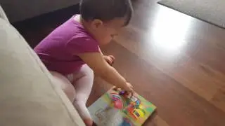 10 month old baby is reading