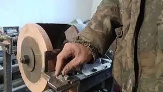 blade, knife, concave lens on emery