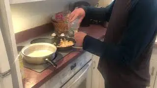 Adding oil to the cooking pot