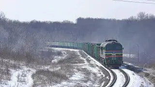 Extreme winter haymaking: Mowing grass in front of a passing train!