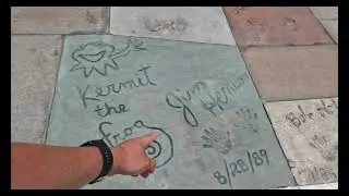 Character handprints outside of Mickey and Minnie's Runaway Railway