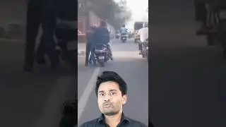 Rapido rider pushes scooter with passenger seated on it