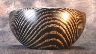 Woodturning a black and gold ash bowl