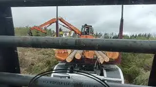 loading logs in Oak Harbor Washington by the military base. Jet fighter plane fly over!