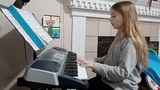 Evelynn plays piano and sings This Is Me