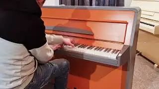 RIPPEN ORANGE AND GREY UPRIGHT PIANO