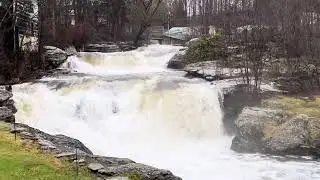 Honesdale Pa water falls behind Black and Brass Coffee shop. Heavy rain March 2024.
