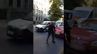 Motorist warns eco protesters then drives his car through their banner