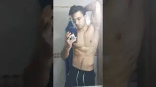 Shredded young bodybuilder mirror flex