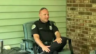 Fr. Mark speaks with community engagement officer and residents in the community