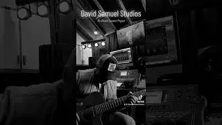 David Samuel trying some new ideas out on his acoustic guitar.