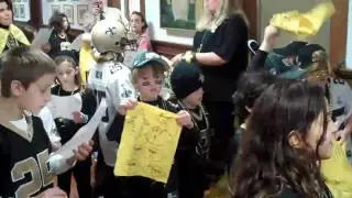 Isidore Newman students sing a song for the Saints