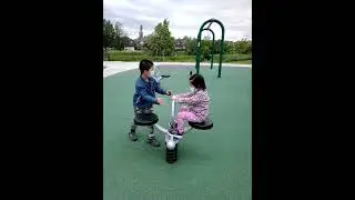 James Cheng and Jacqueline Cheng at park children playground seesaw