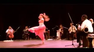 Lolie dancing with live orchestra performing 