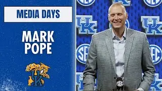 Mark Pope at the podium at SEC Media Days