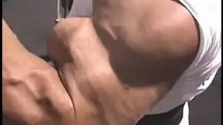Bodybuilder Chris Bennett trains biceps